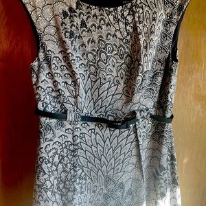 Brand New dress in black and white pattern. Black belt, slight cap sleeve.